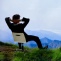 relaxed man from the office on hillside, happy, stress Less